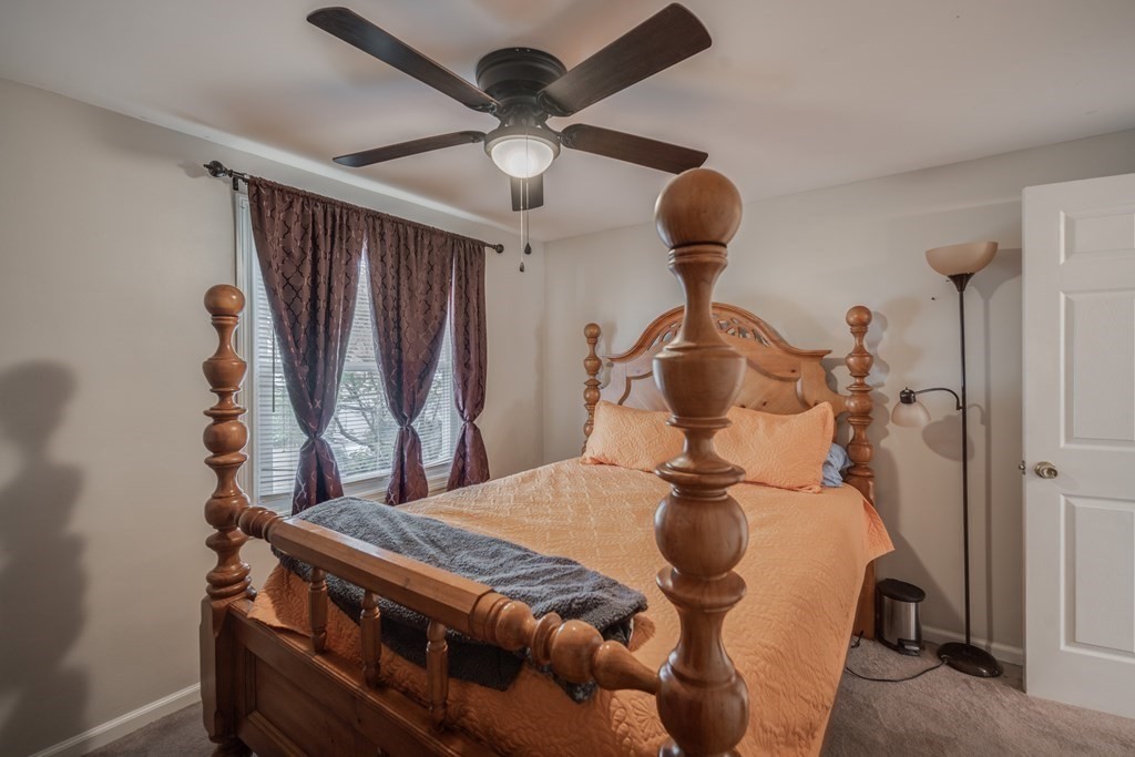 4 Jean Drive Springfield, MA 01104 - Photo 21 of 26 a bedroom with a bed and a chandelier