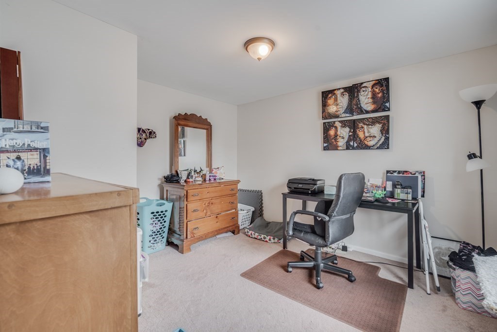 4 Jean Drive Springfield, MA 01104 - Photo 22 of 26 a view of a workspace with furniture and a bedroom