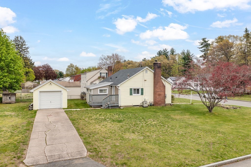 4 Jean Drive Springfield, MA 01104 - Photo 6 of 26 a front view of a house with garden