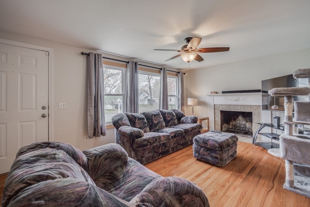 4 Jean Drive Springfield, MA 01104 - Photo 9 of 26 a living room with furniture a fireplace and a large window