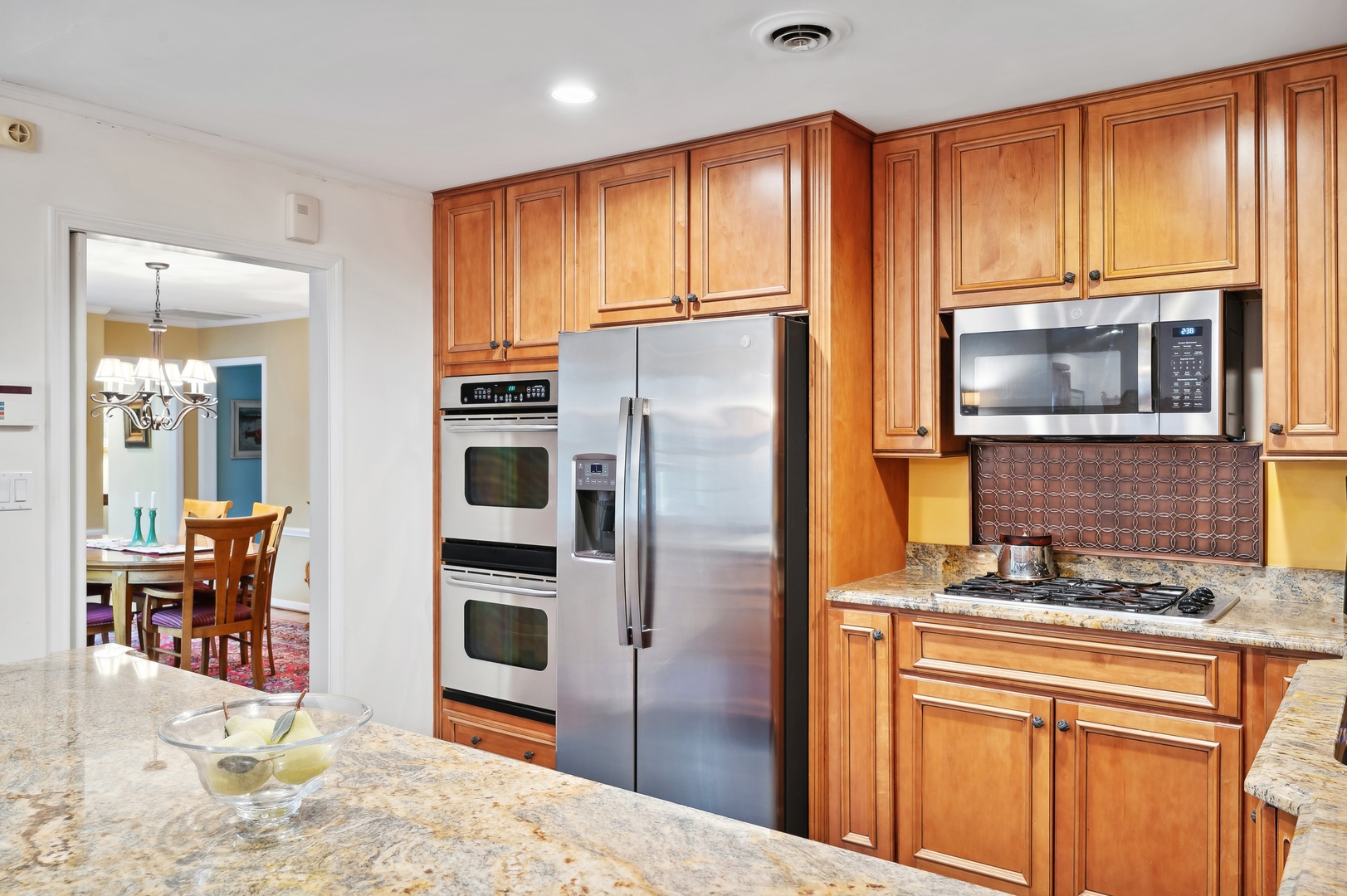749 North Happ Road Northfield, IL 60093 - Photo 7 of 33 a kitchen with stainless steel appliances granite countertop a refrigerator a stove top oven a sink and dishwasher