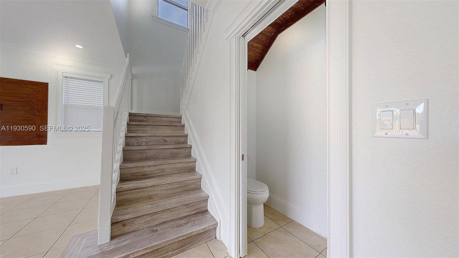 25324 Southwest 119th Avenue Homestead, FL 33032 - Photo 20 of 41 a view of a hallway with wooden floor and entryway