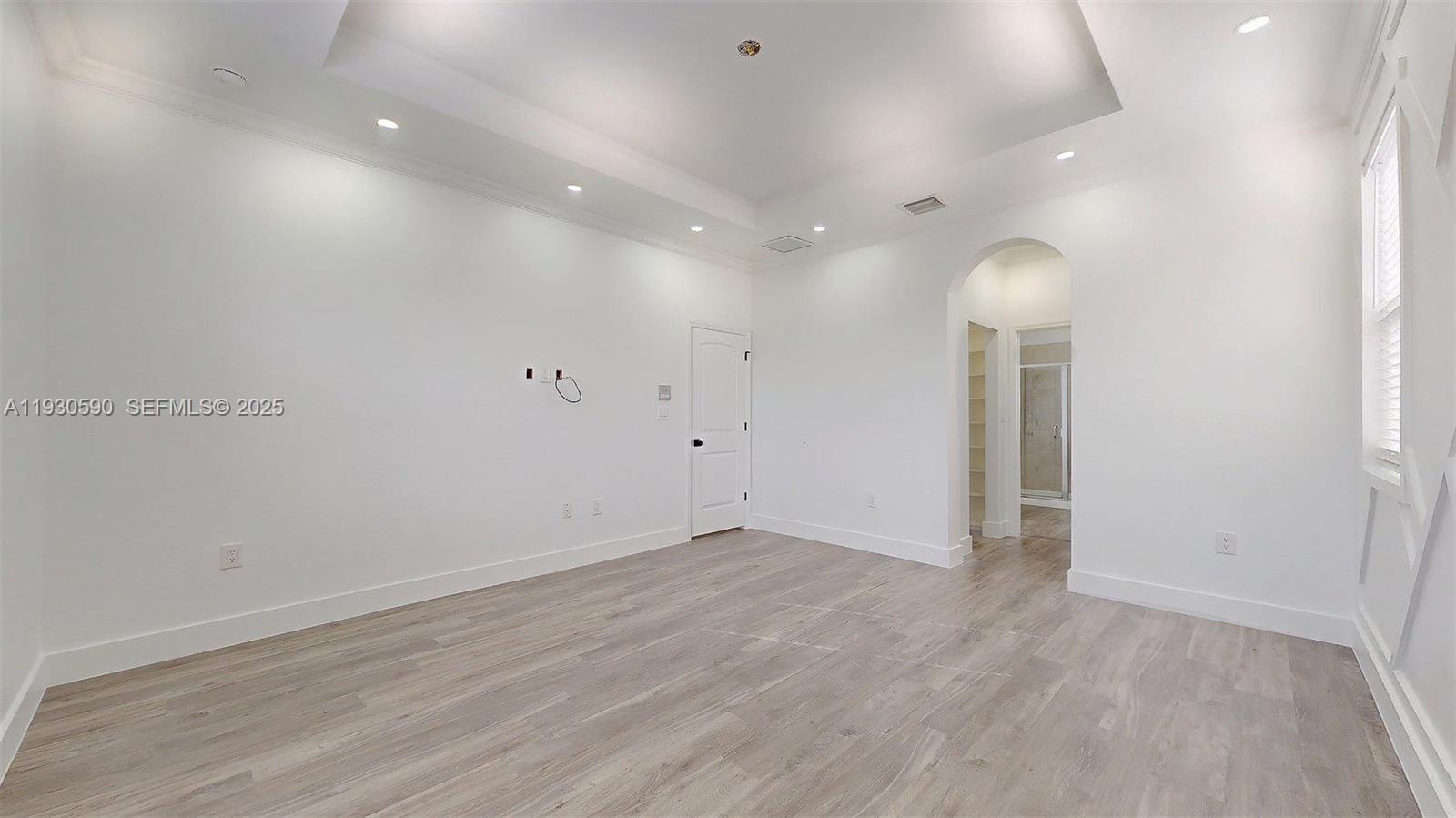 25324 Southwest 119th Avenue Homestead, FL 33032 - Photo 32 of 41 wooden floor in an empty room with a window