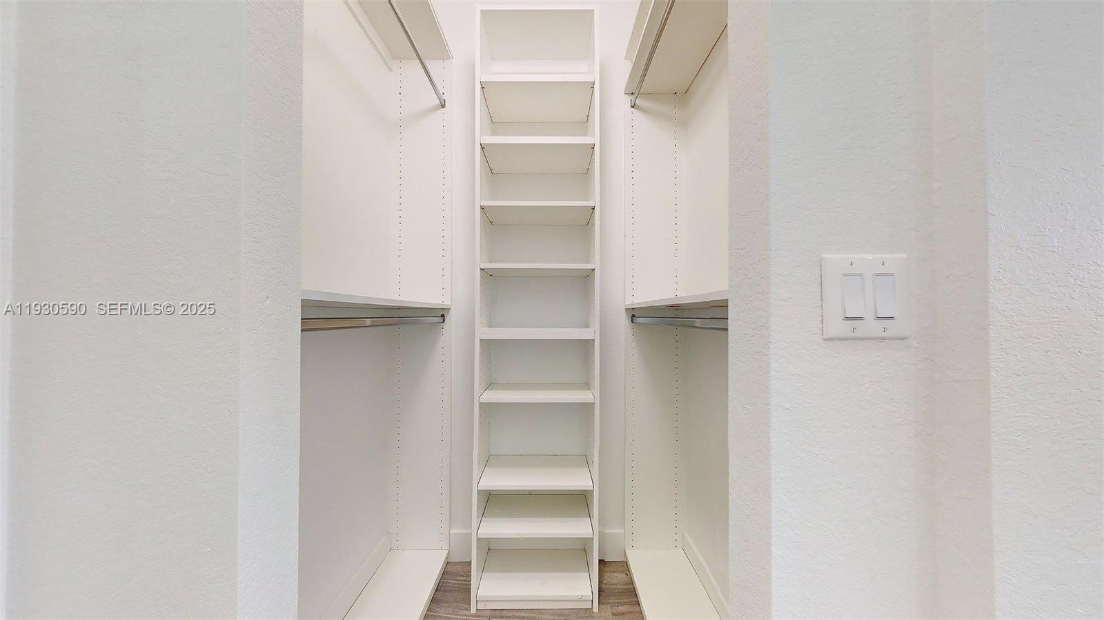 25324 Southwest 119th Avenue Homestead, FL 33032 - Photo 34 of 41 a view of walk in closet with empty racks