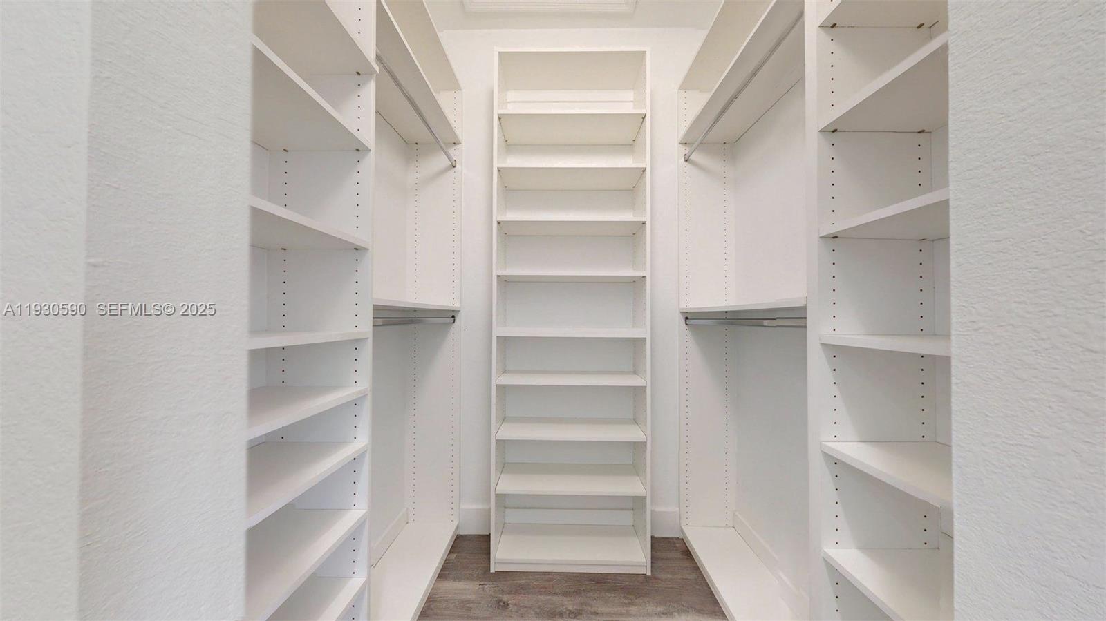 25324 Southwest 119th Avenue Homestead, FL 33032 - Photo 35 of 41 a view of walk in closet with empty racks