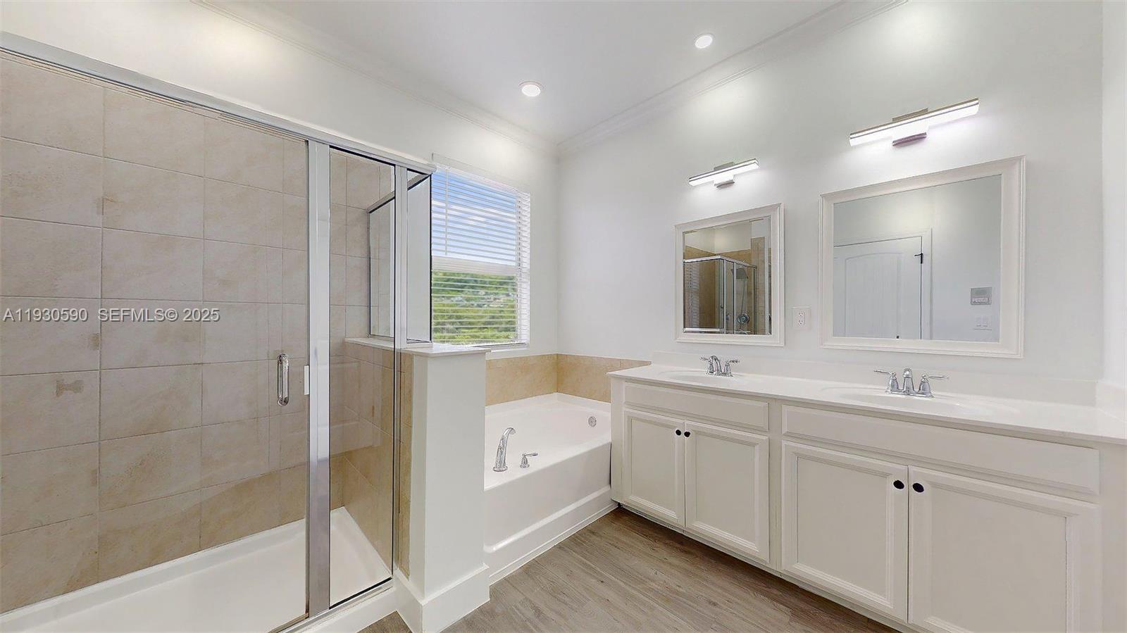 25324 Southwest 119th Avenue Homestead, FL 33032 - Photo 36 of 41 a bathroom with a tub sink and mirror