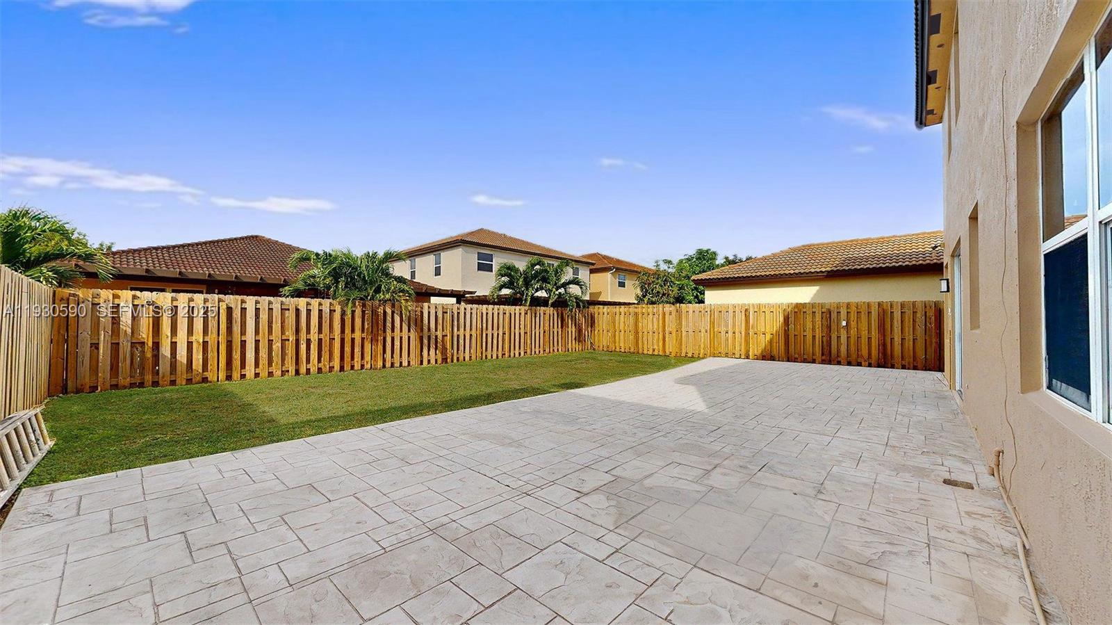 25324 Southwest 119th Avenue Homestead, FL 33032 - Photo 40 of 41 a view of a house with a yard
