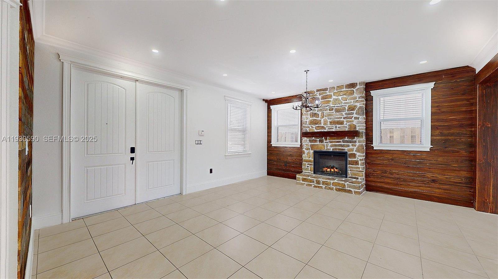 25324 Southwest 119th Avenue Homestead, FL 33032 - Photo 4 of 41 a view of an empty room with a fireplace