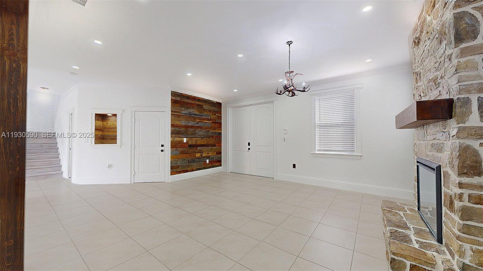 25324 Southwest 119th Avenue Homestead, FL 33032 - Photo 7 of 41 a view of a livingroom with a fireplace