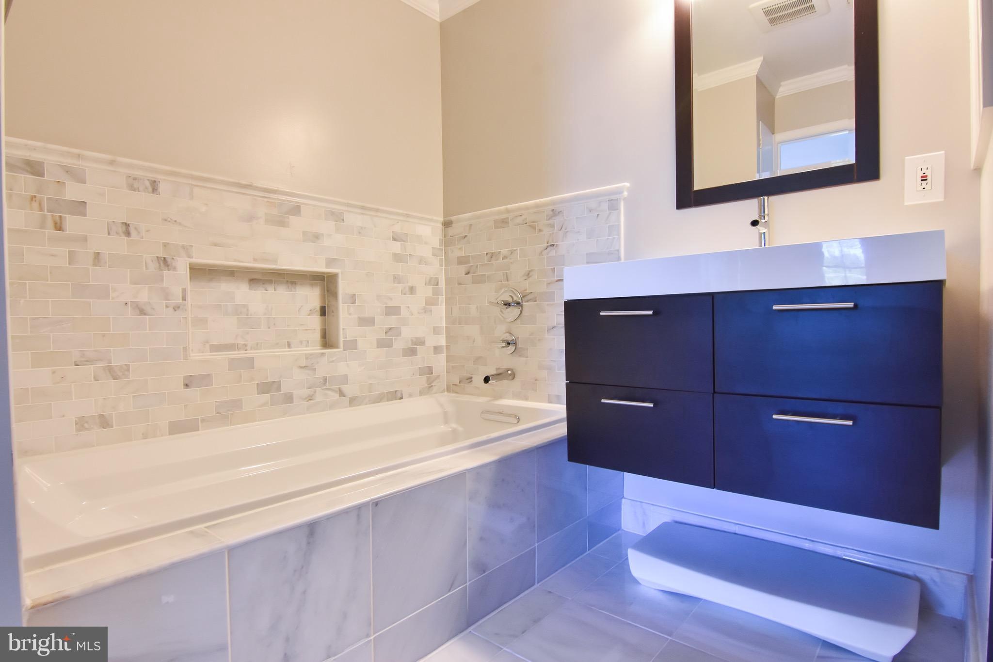 3302 Spring Lane Falls Church, VA 22041 - Photo 17 of 30 a bathroom with a bathtub and a sink