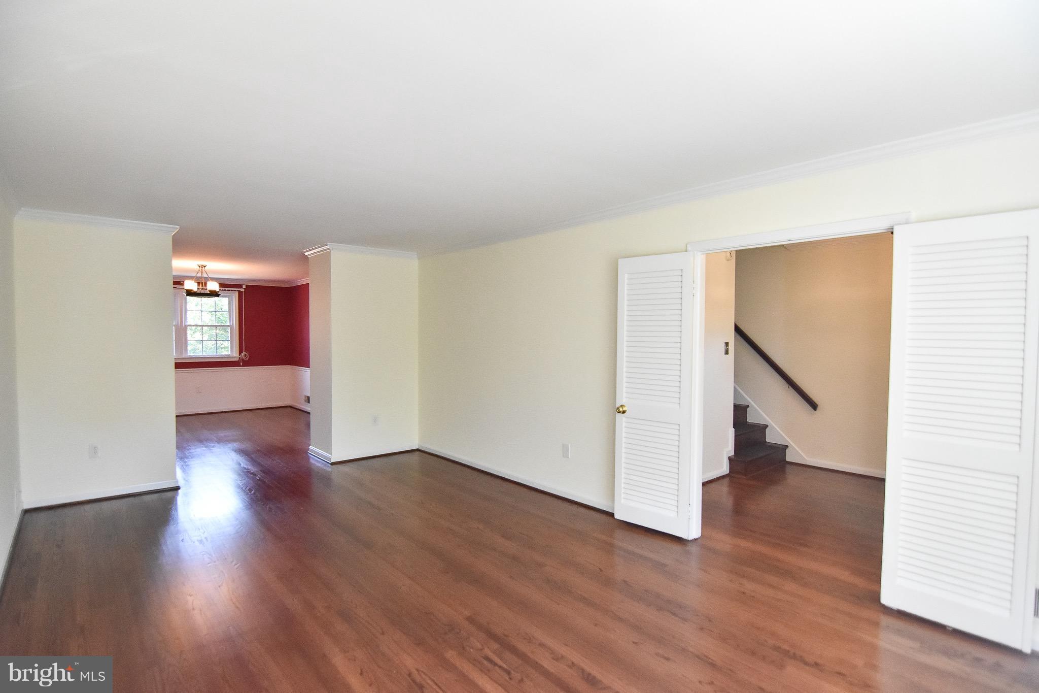 3302 Spring Lane Falls Church, VA 22041 - Photo 3 of 30 a view of empty room with wooden floor and stairs