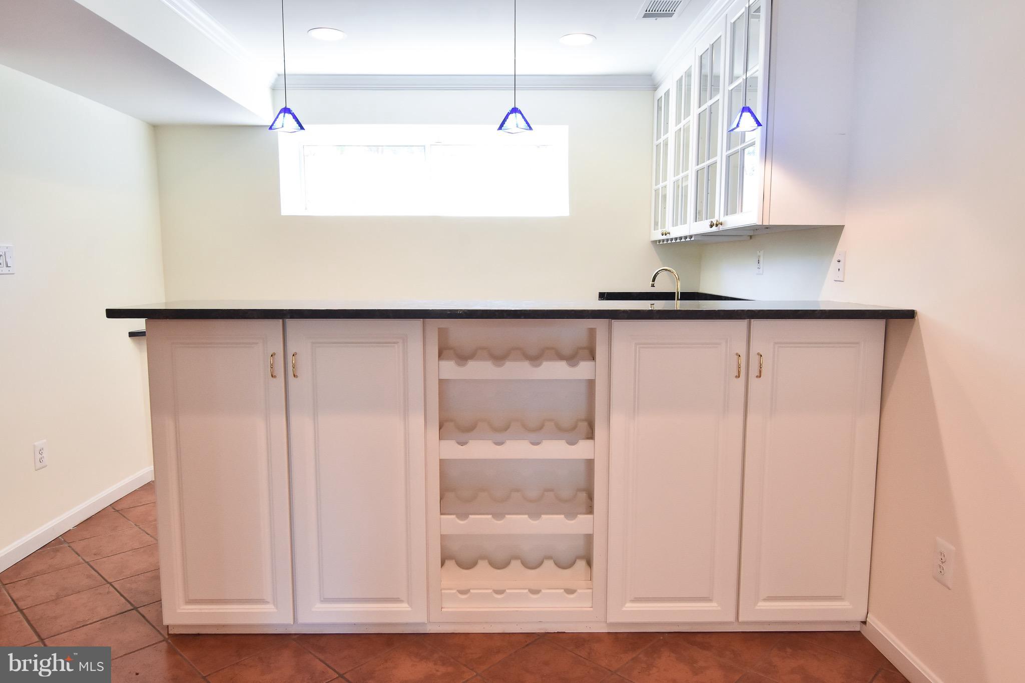 3302 Spring Lane Falls Church, VA 22041 - Photo 21 of 30 a close view of cabinet a microwave and cabinets