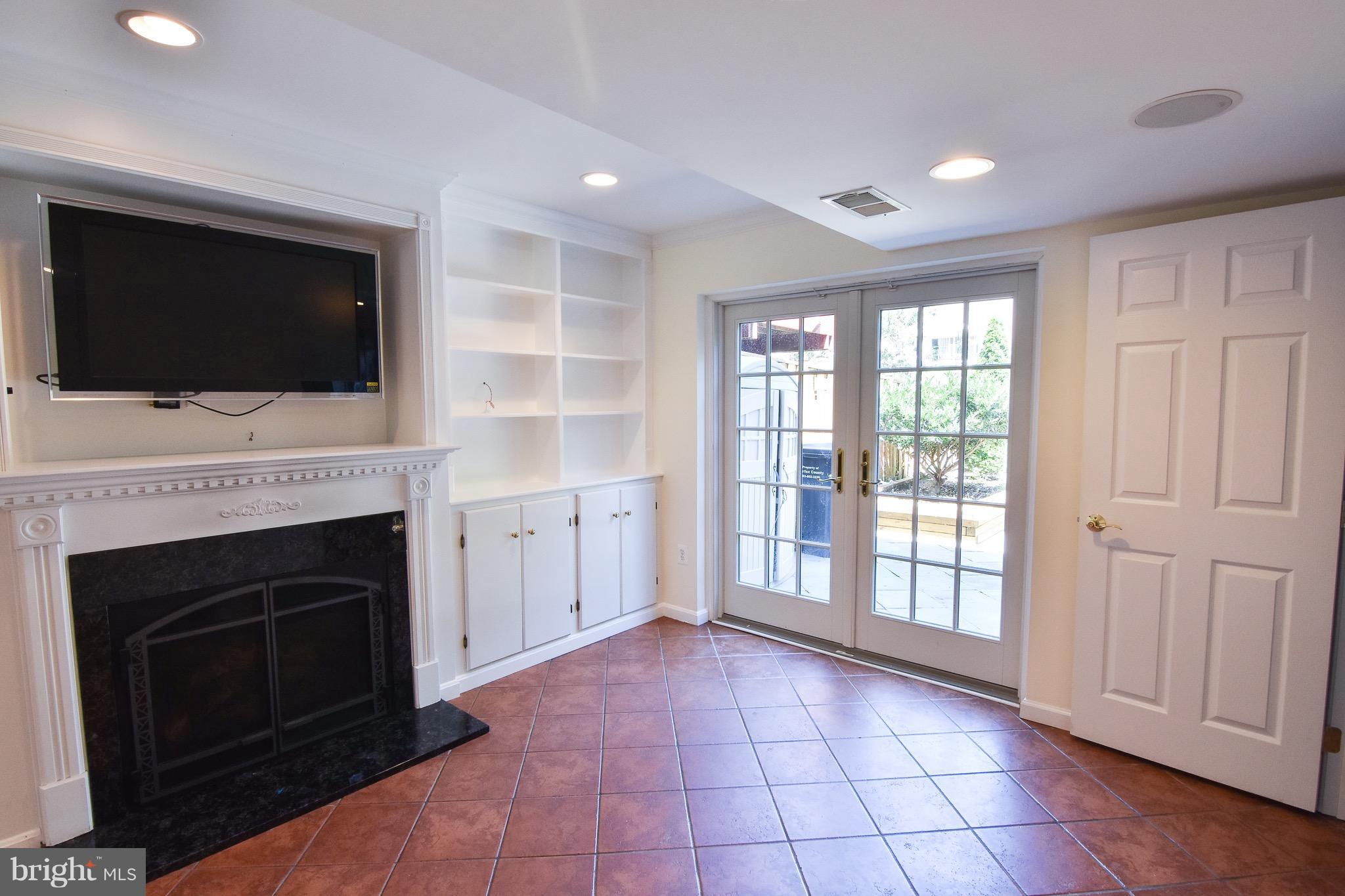 3302 Spring Lane Falls Church, VA 22041 - Photo 23 of 30 a view of an empty room with a fireplace and a window