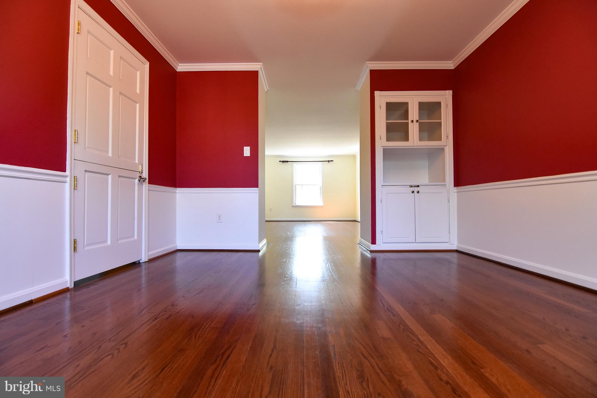 3302 Spring Lane Falls Church, VA 22041 - Photo 5 of 30 a view of an empty room with wooden floor and a window
