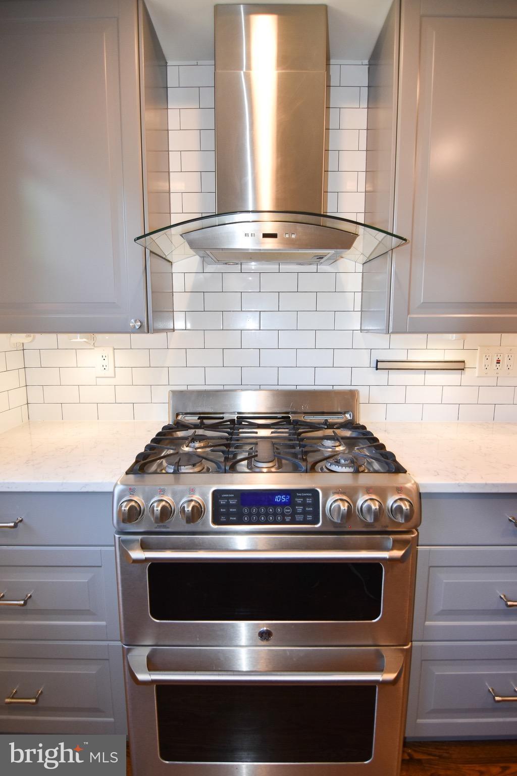 3302 Spring Lane Falls Church, VA 22041 - Photo 10 of 30 a stove top oven sitting inside of a kitchen