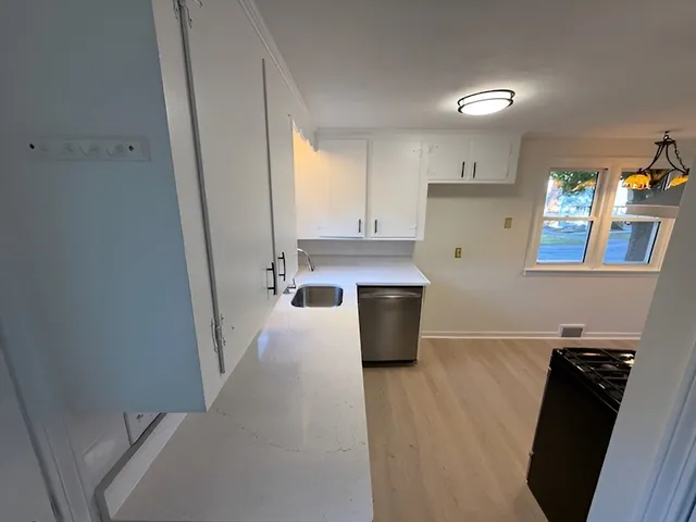 a view of a kitchen with a sink