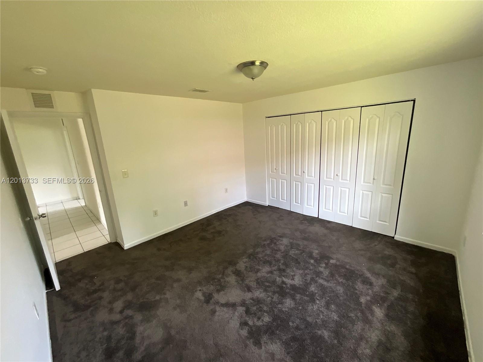 209 Northeast 141st Street, Unit 4 Miami, FL 33161 - Photo 6 of 13 a view of empty room