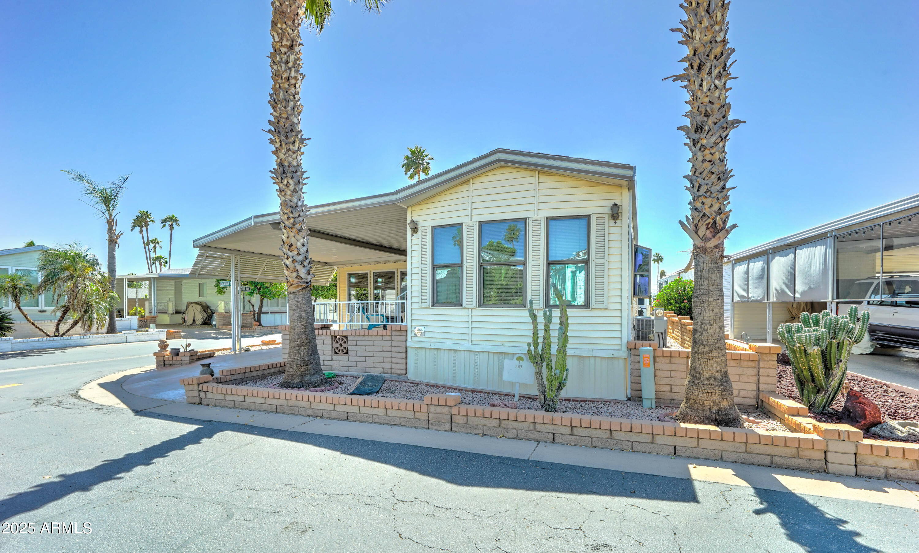 111 South Greenfield Road, Unit 547 Mesa, AZ 85206 - Photo 8 of 28 Garden window and Palm Trees