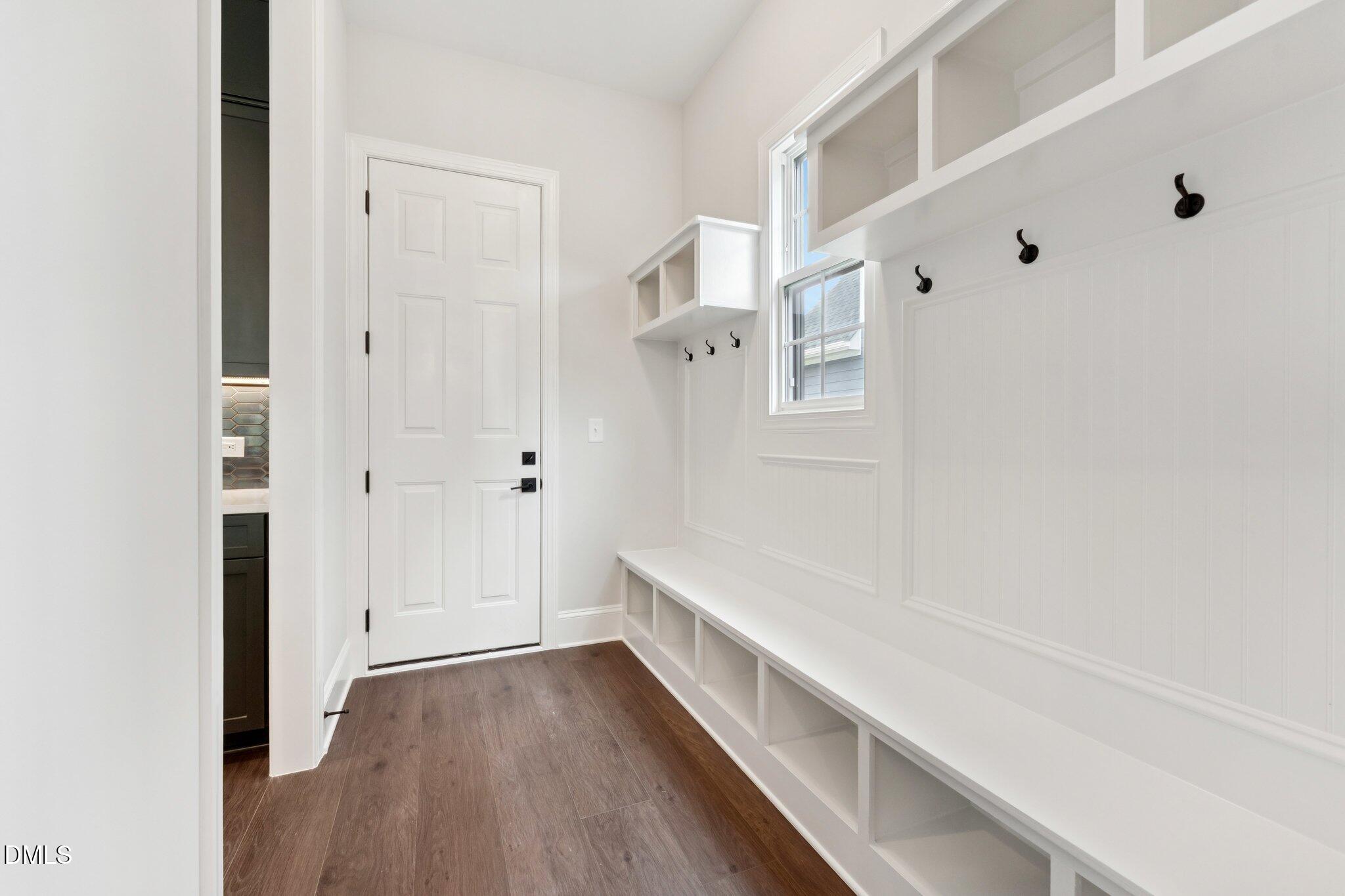 269 Ridge Road Chapel Hill, NC 27516 - Photo 12 of 41 a hallway with white cabinets and wooden floor
