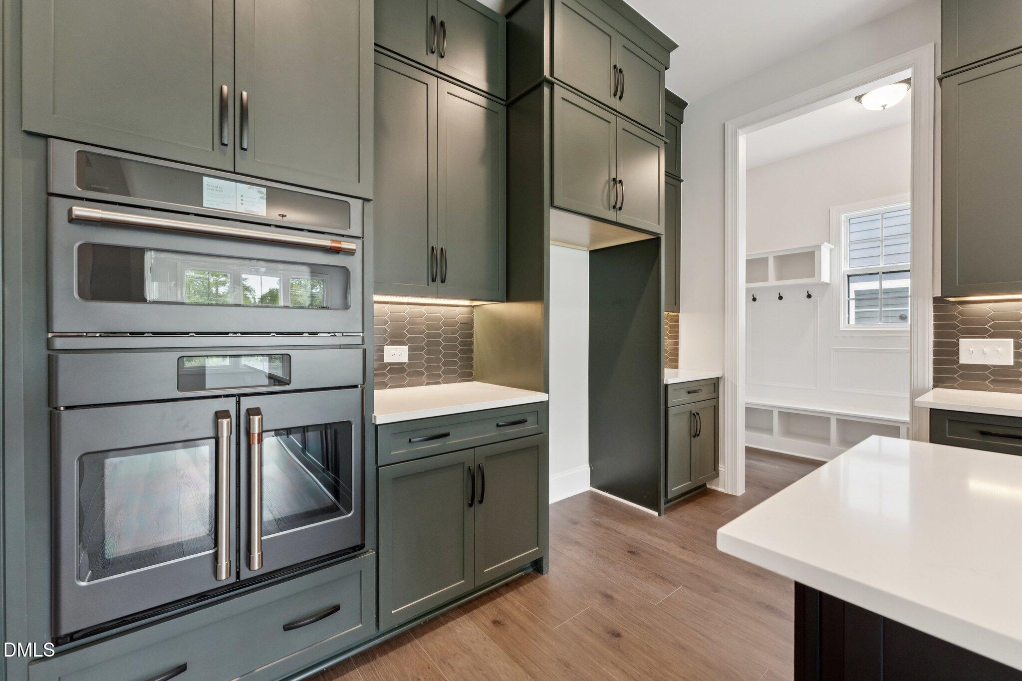 269 Ridge Road Chapel Hill, NC 27516 - Photo 17 of 41 a kitchen with stainless steel appliances granite countertop a stove and a refrigerator