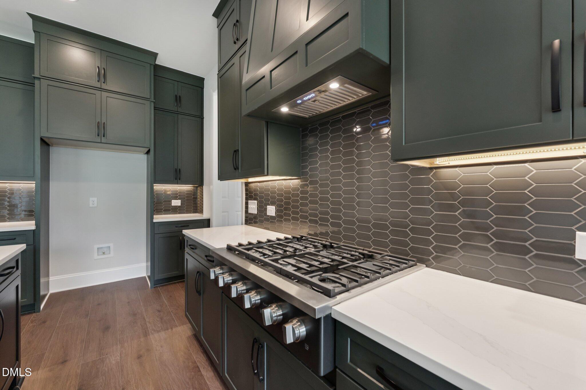 269 Ridge Road Chapel Hill, NC 27516 - Photo 19 of 41 a kitchen that has a stove and a wooden floor