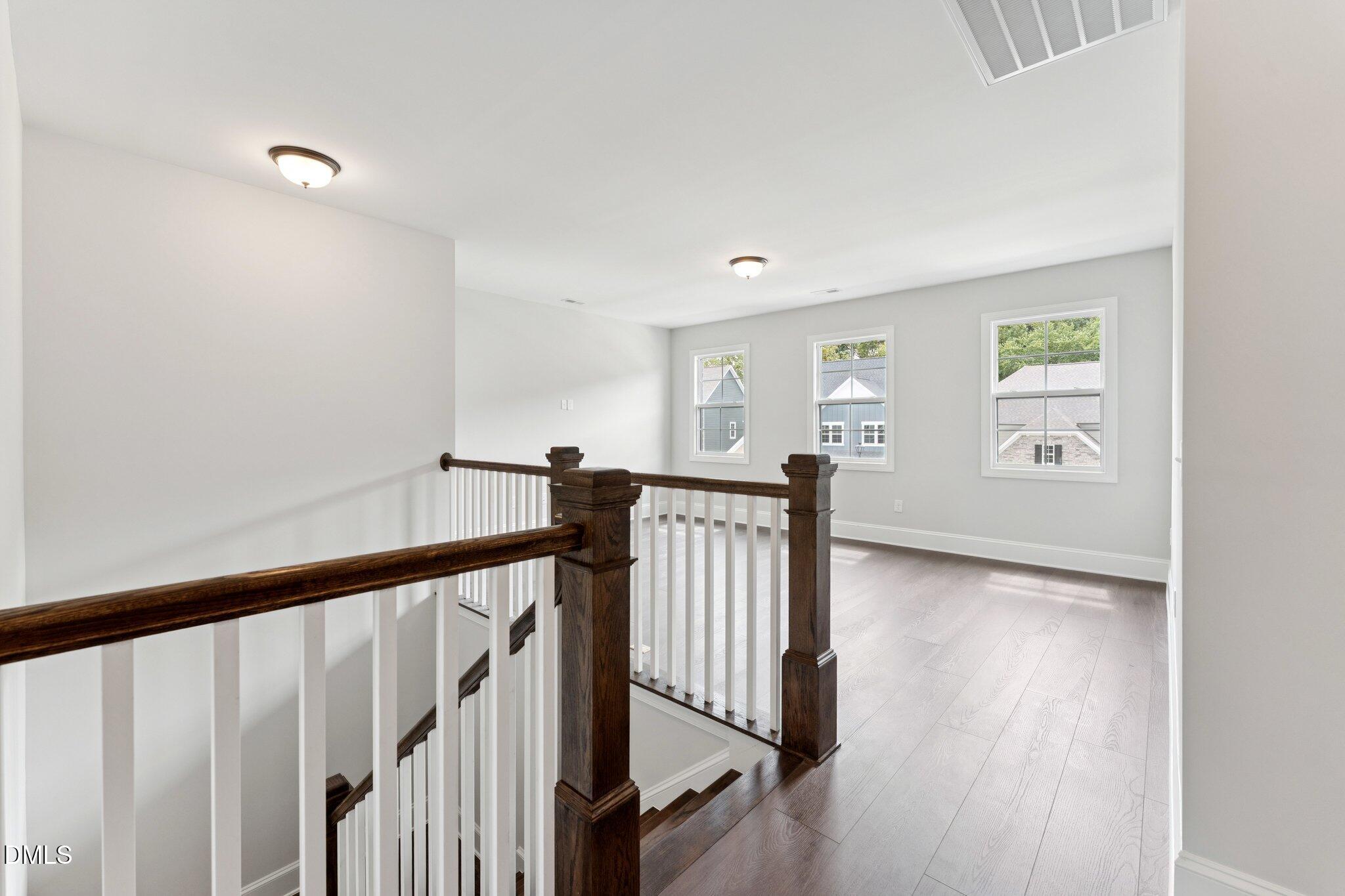 269 Ridge Road Chapel Hill, NC 27516 - Photo 25 of 41 a view of a hallway with wooden floor and stairs