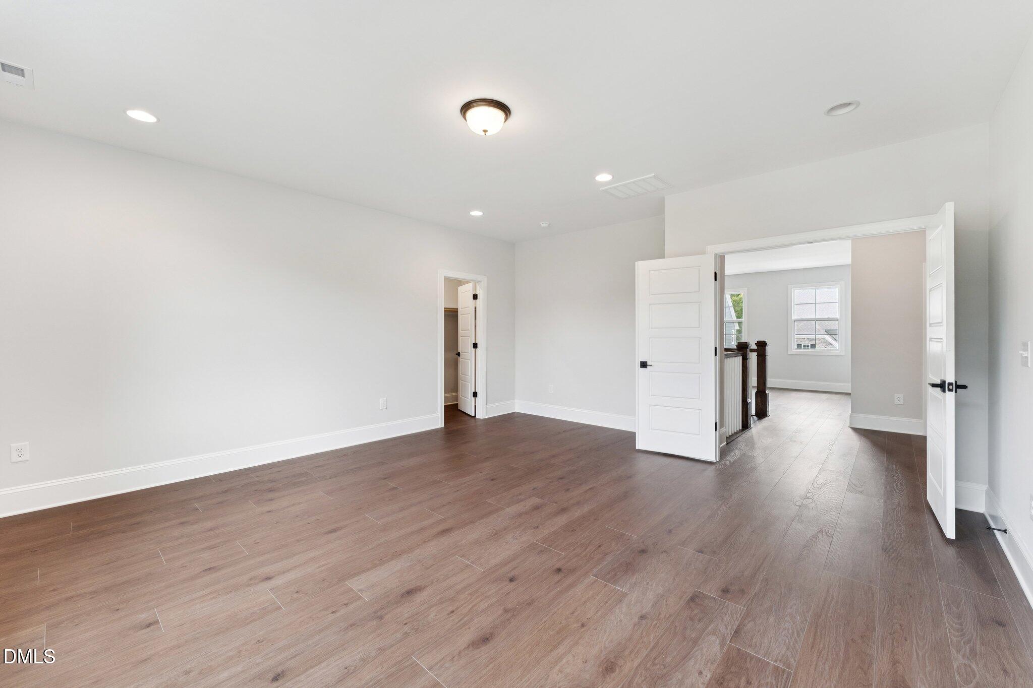 269 Ridge Road Chapel Hill, NC 27516 - Photo 29 of 41 a view of a big room with wooden floor and windows