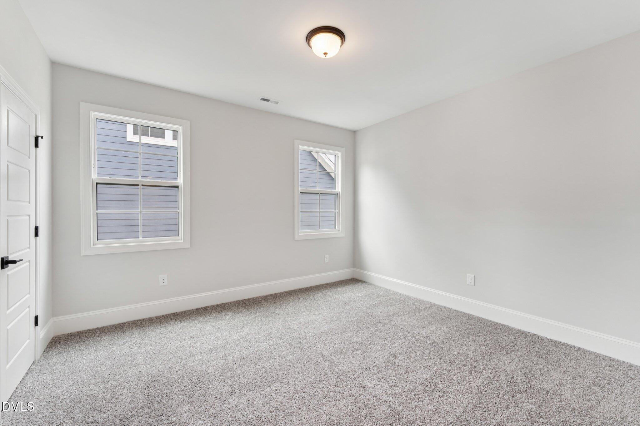 269 Ridge Road Chapel Hill, NC 27516 - Photo 31 of 41 an empty room with windows