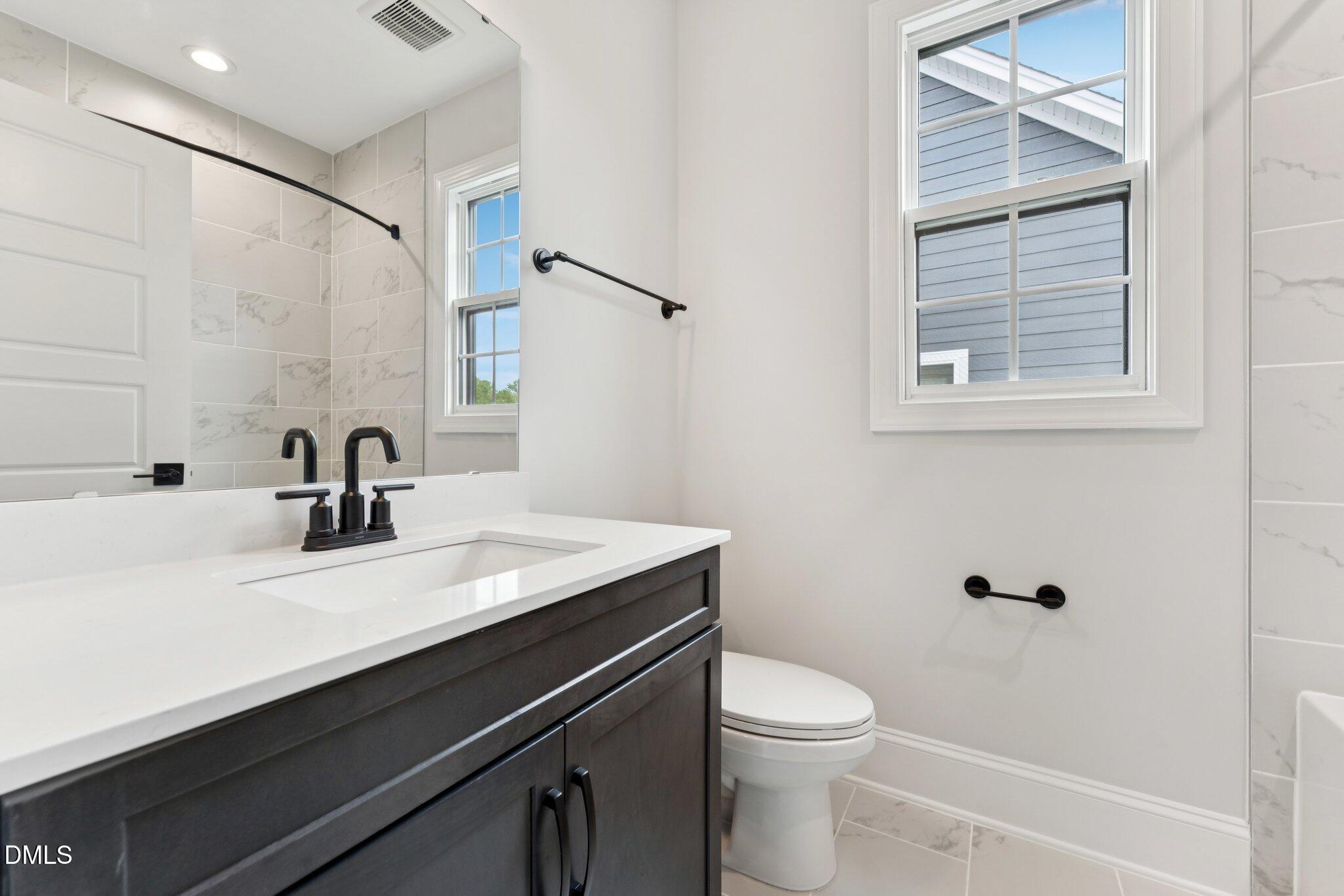 269 Ridge Road Chapel Hill, NC 27516 - Photo 33 of 41 a bathroom with a sink a toilet and shower