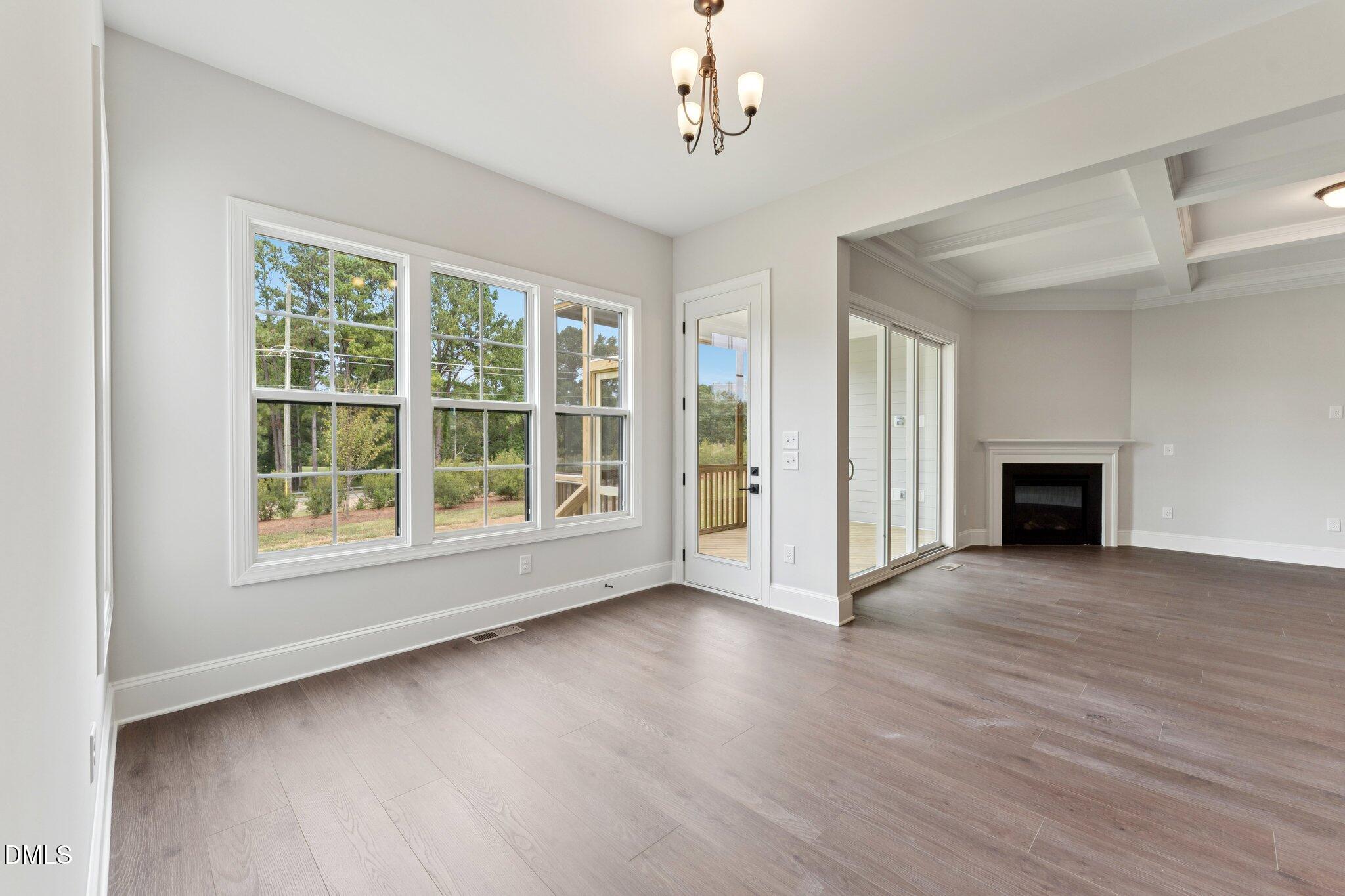 269 Ridge Road Chapel Hill, NC 27516 - Photo 9 of 41 a view of an empty room with wooden floor and a window
