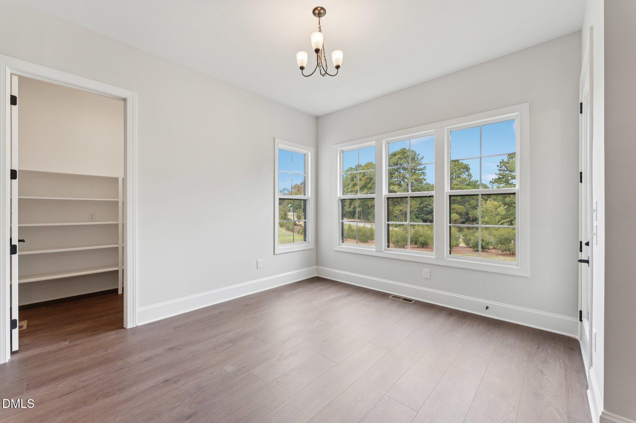 269 Ridge Road Chapel Hill, NC 27516 - Photo 10 of 41 a view of room with window and hardwood floor