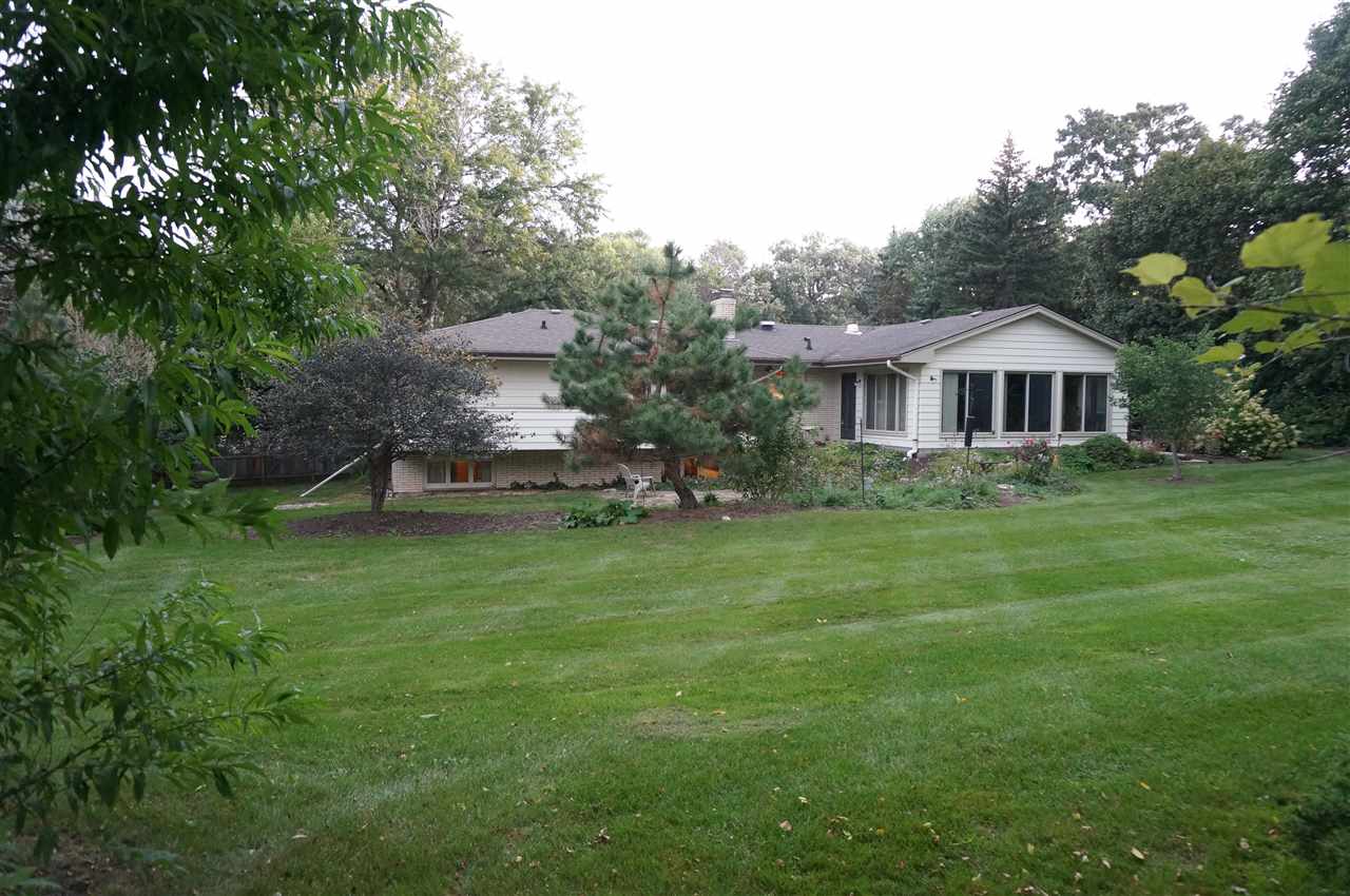 4615 Spring Creek Road Rockford, IL 61107 - Photo 3 of 14 a front view of house with yard and green space