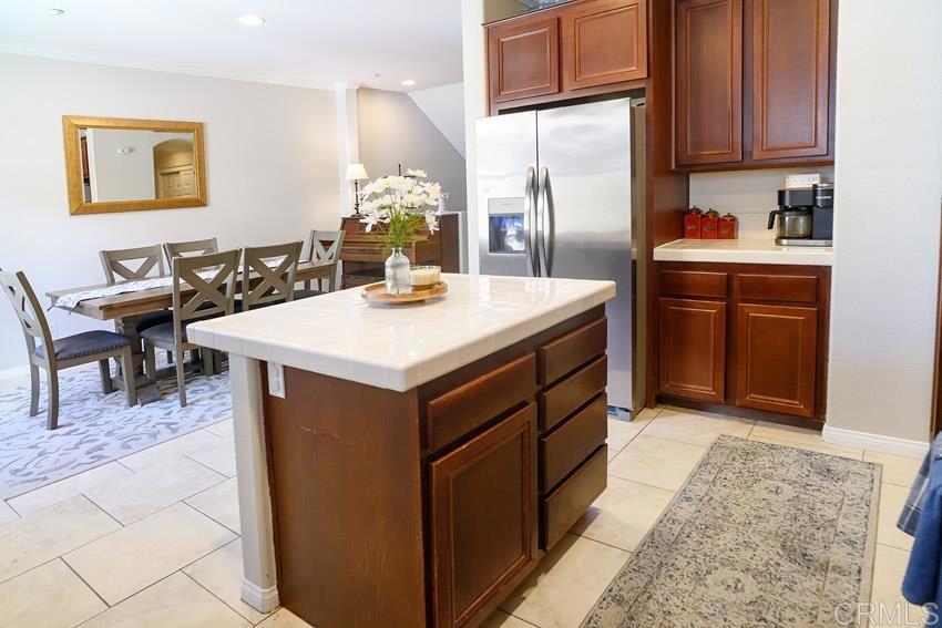 2232 Huntington Point Road, Unit 53 Chula Vista, CA 91914 - Photo 11 of 37 a kitchen with a sink refrigerator and cabinets