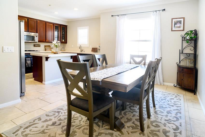 2232 Huntington Point Road, Unit 53 Chula Vista, CA 91914 - Photo 14 of 37 a view of a dining room with furniture