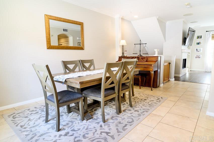 2232 Huntington Point Road, Unit 53 Chula Vista, CA 91914 - Photo 15 of 37 a dining room with furniture and wooden floor