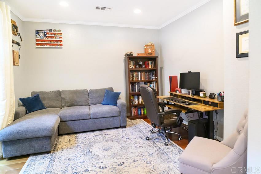 2232 Huntington Point Road, Unit 53 Chula Vista, CA 91914 - Photo 18 of 37 a living room with furniture a flat screen tv and a window