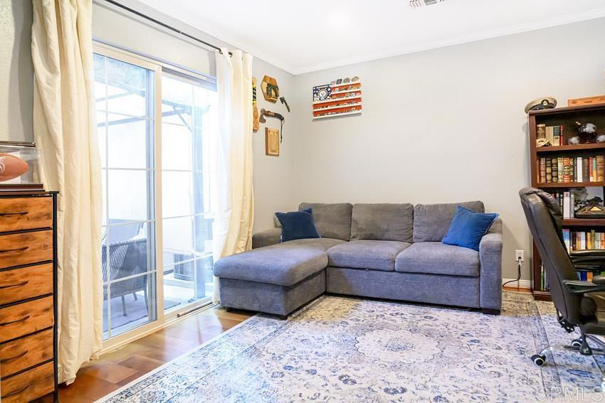 2232 Huntington Point Road, Unit 53 Chula Vista, CA 91914 - Photo 19 of 37 a living room with furniture and a book shelf