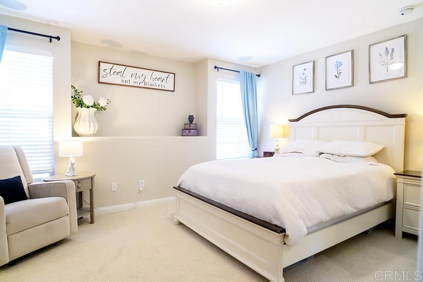 2232 Huntington Point Road, Unit 53 Chula Vista, CA 91914 - Photo 25 of 37 a bedroom with a bed and a couch