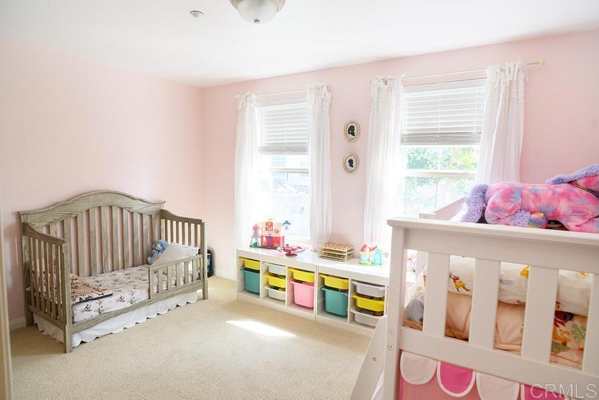 2232 Huntington Point Road, Unit 53 Chula Vista, CA 91914 - Photo 28 of 37 a bedroom with furniture and a window