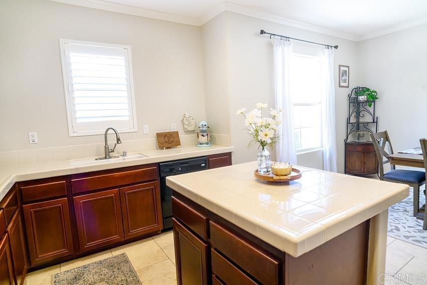 2232 Huntington Point Road, Unit 53 Chula Vista, CA 91914 - Photo 32 of 37 a kitchen with a sink and cabinets