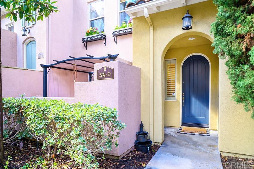 2232 Huntington Point Road, Unit 53 Chula Vista, CA 91914 - Photo 35 of 37 a front view of a house with balcony and garden