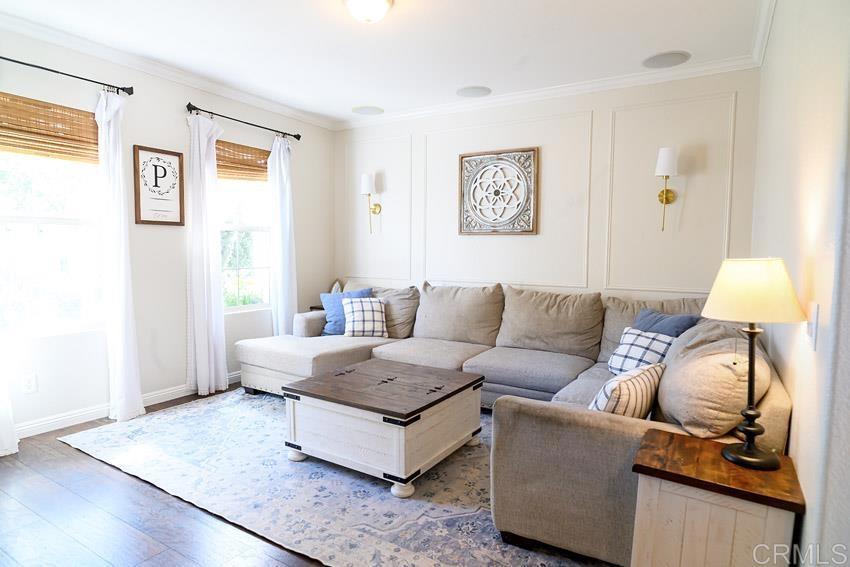 2232 Huntington Point Road, Unit 53 Chula Vista, CA 91914 - Photo 8 of 37 a living room with furniture and a lamp