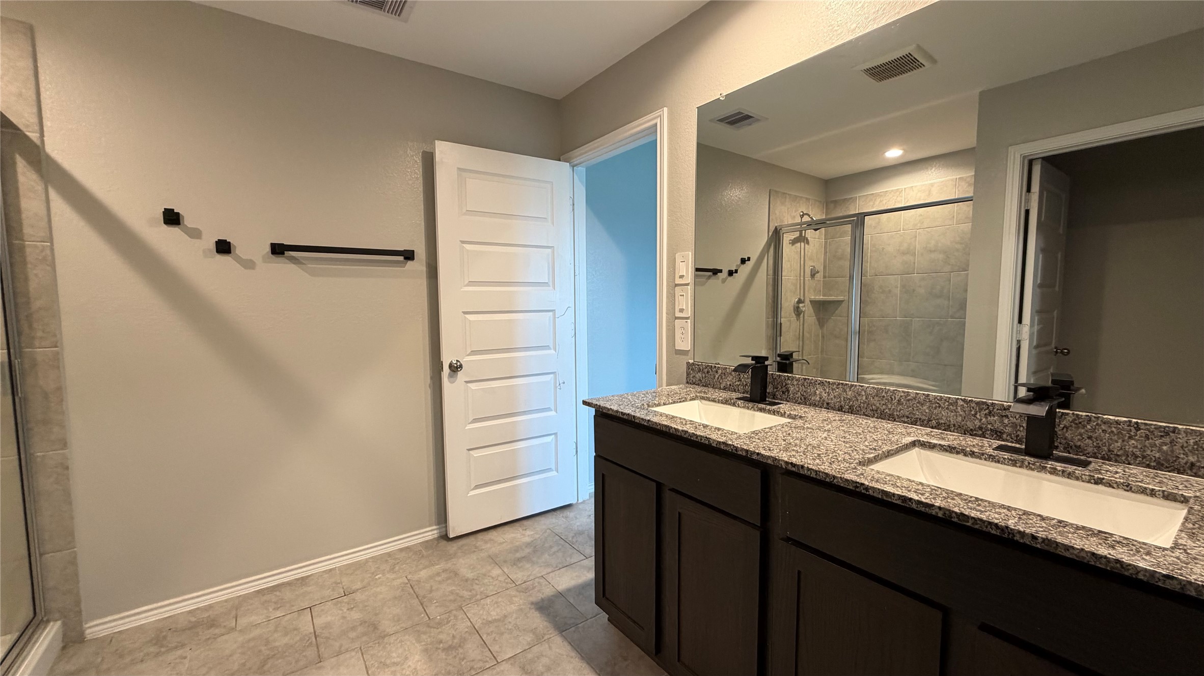 7518 Cynomys Court Rosharon, TX 77583 - Photo 18 of 21 a bathroom with a granite countertop sink and a mirror