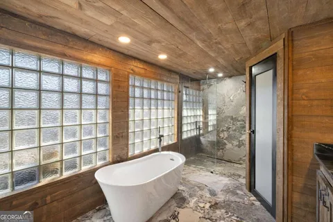 a bathroom with a toilet a sink and a mirror