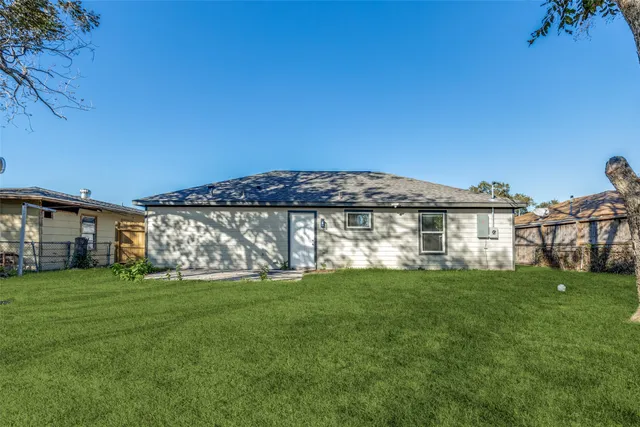 a view of a building with a yard