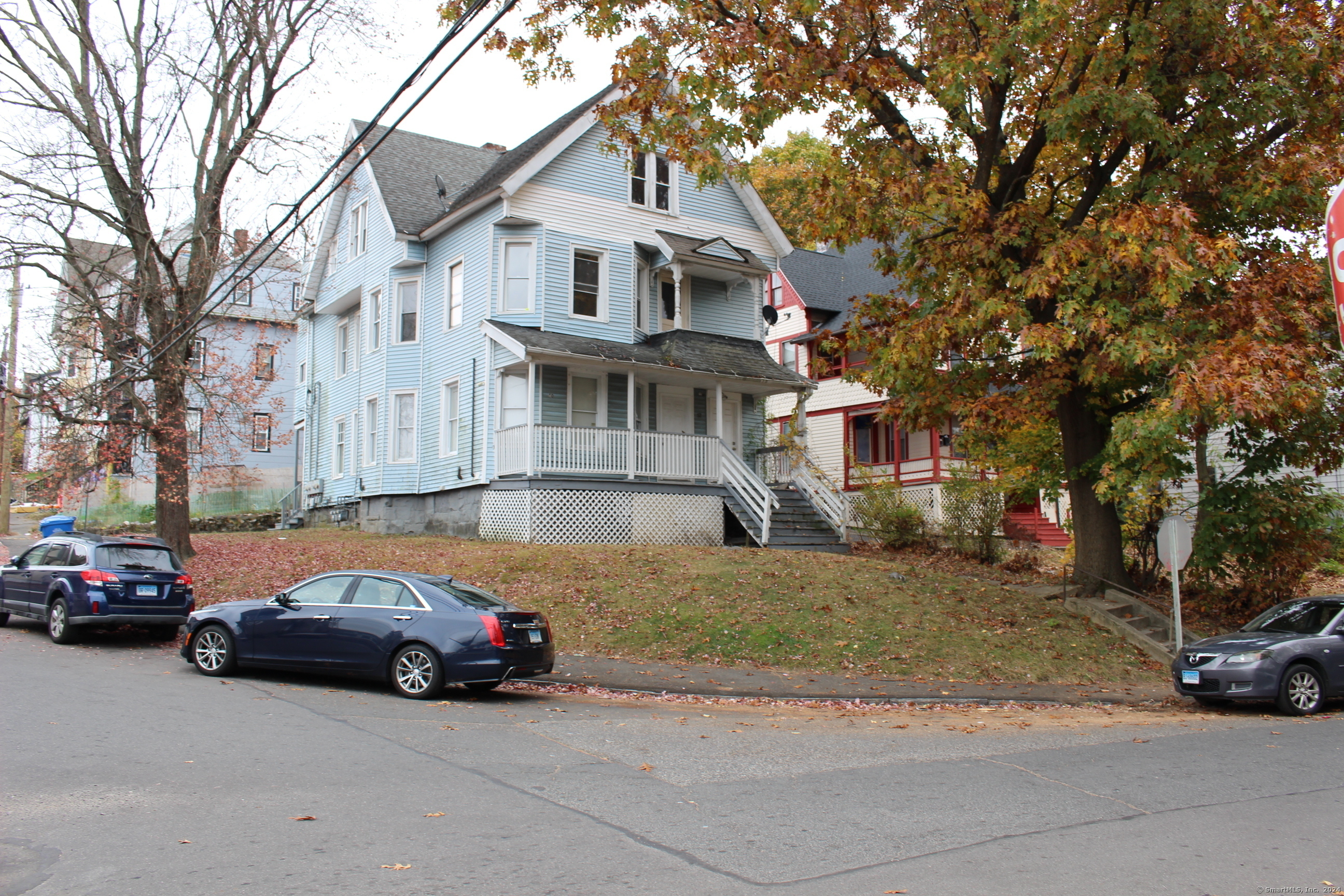 50 Manhan Street Waterbury, CT 06710 - Photo 1 of 1 a car parked in front of a white house
