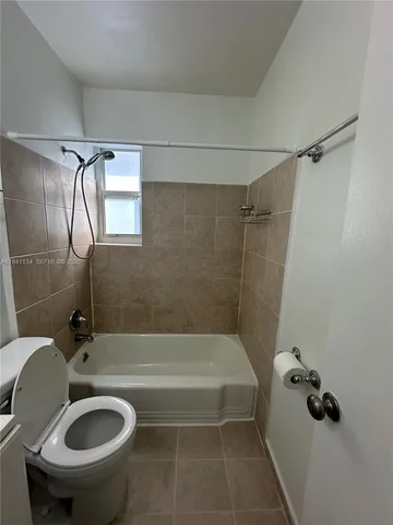 a bathroom with a sink a toilet and a bathtub