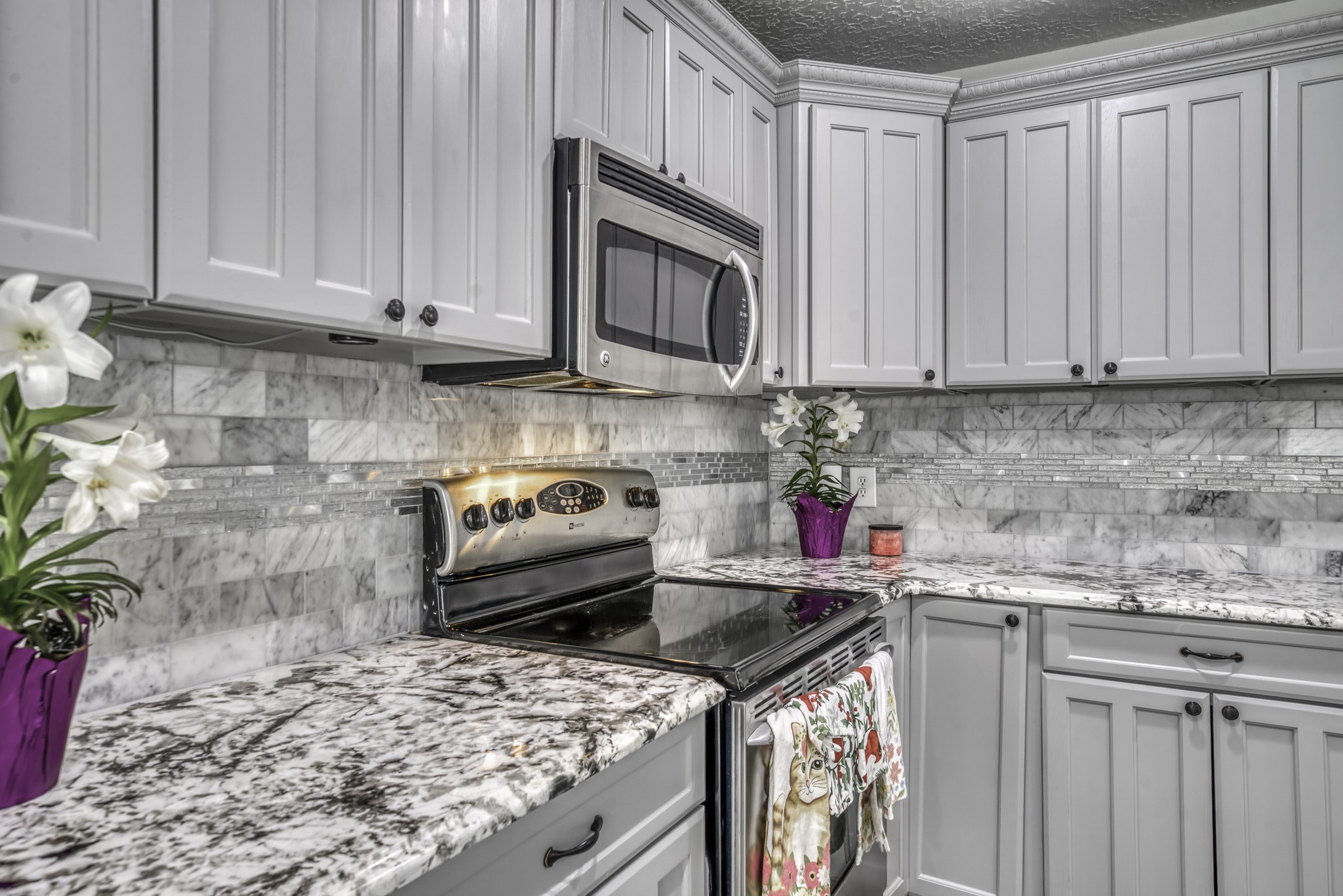 2266 Dutton Lane Madisonville, TX 77864 - Photo 12 of 50 a kitchen with stainless steel appliances granite countertop a stove a sink and dishwasher
