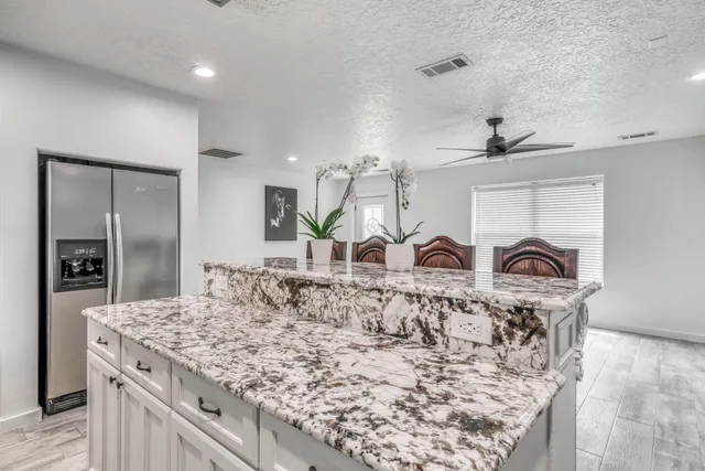 a view of a kitchen counter space and window