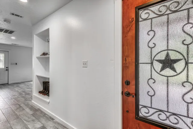 a bathroom with a mirror and a shower